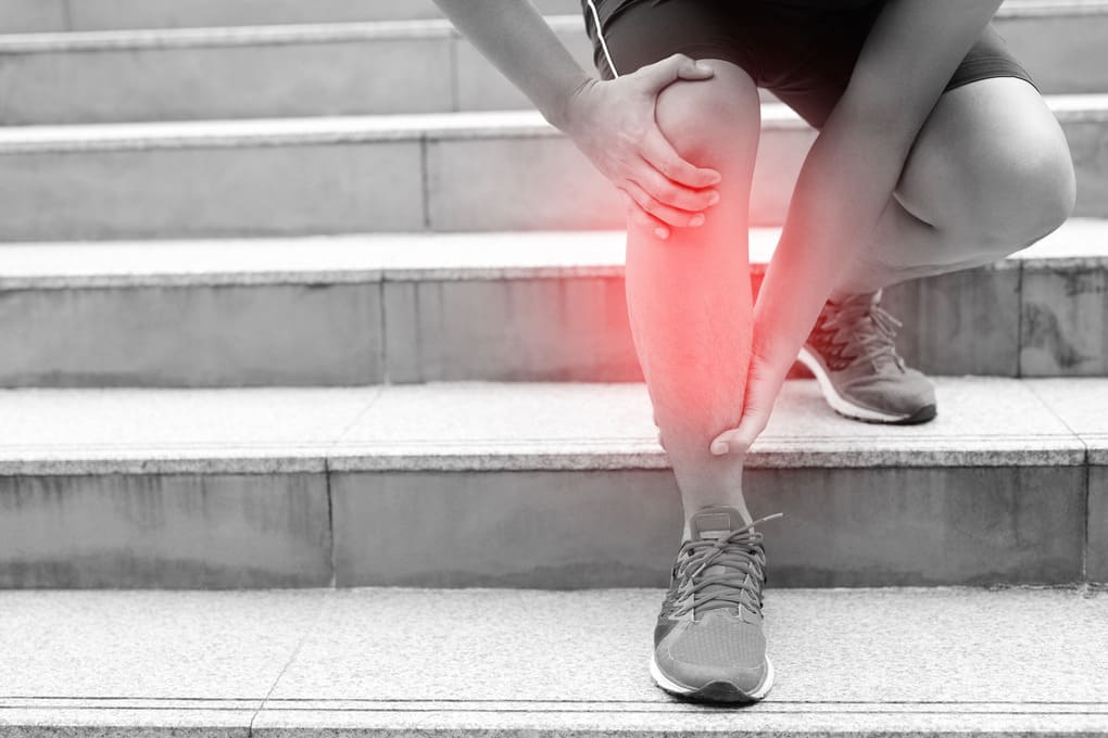 runner-touching-painful-twisted-or-broken-athlete-training-running-up-and-down-stairs-accident-sport-sprained-sprain-cause-injury-knee-and-pain-with-leg-bones